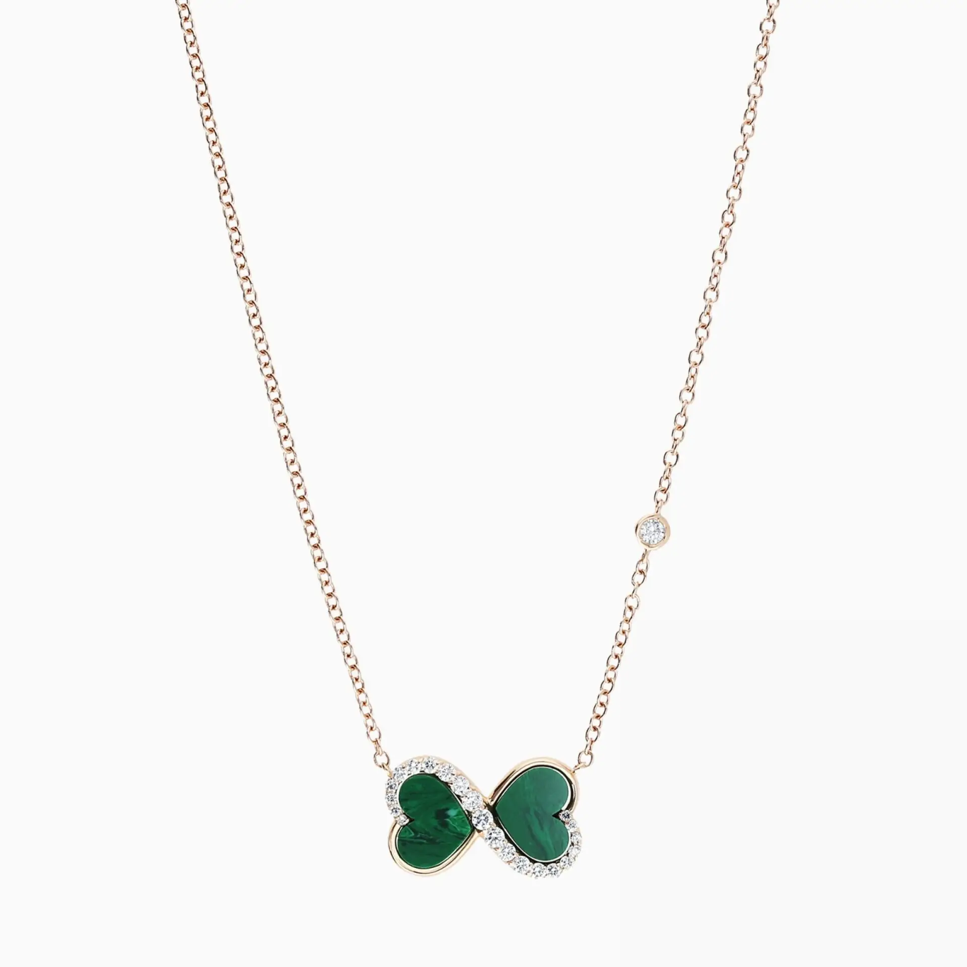 Colgante con símbolo infinito de oro rosa con malaquita talla corazón y diamantes