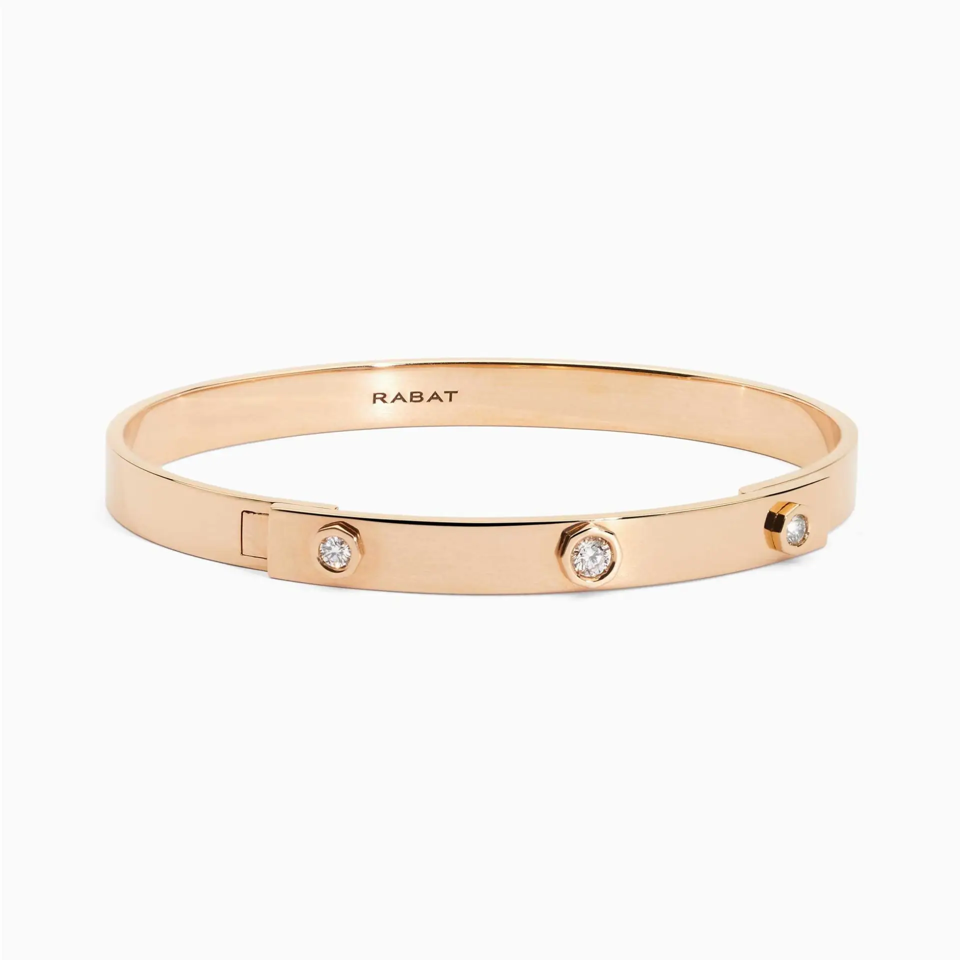 Pulsera rígida de oro rosa con tres diamantes