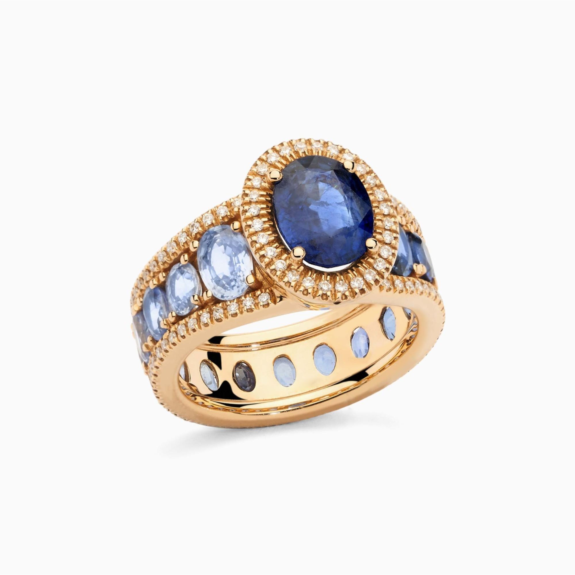 Anillo de oro rosa con zafiro azul central y brazo de zafiros azules