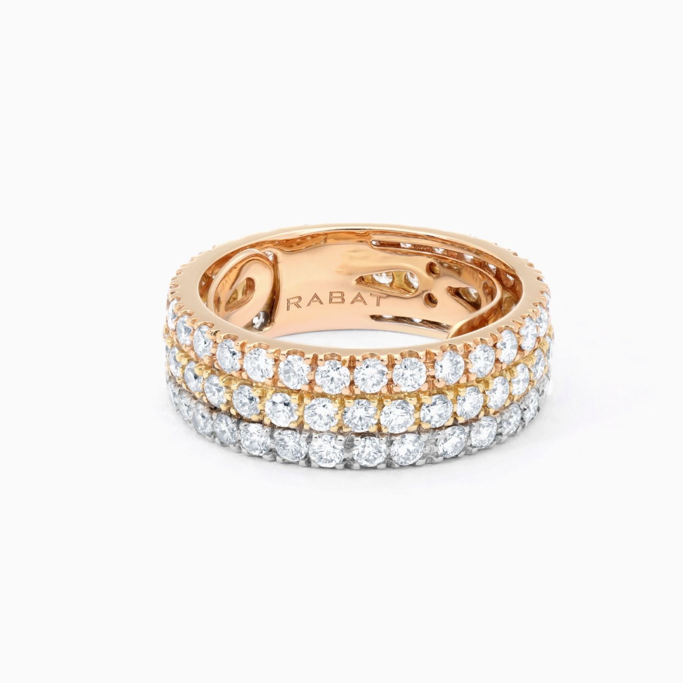 Three gold ring with rows of diamonds