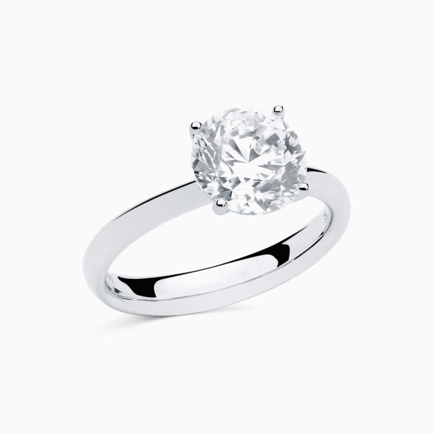 White gold solitaire engagement ring with central diamond