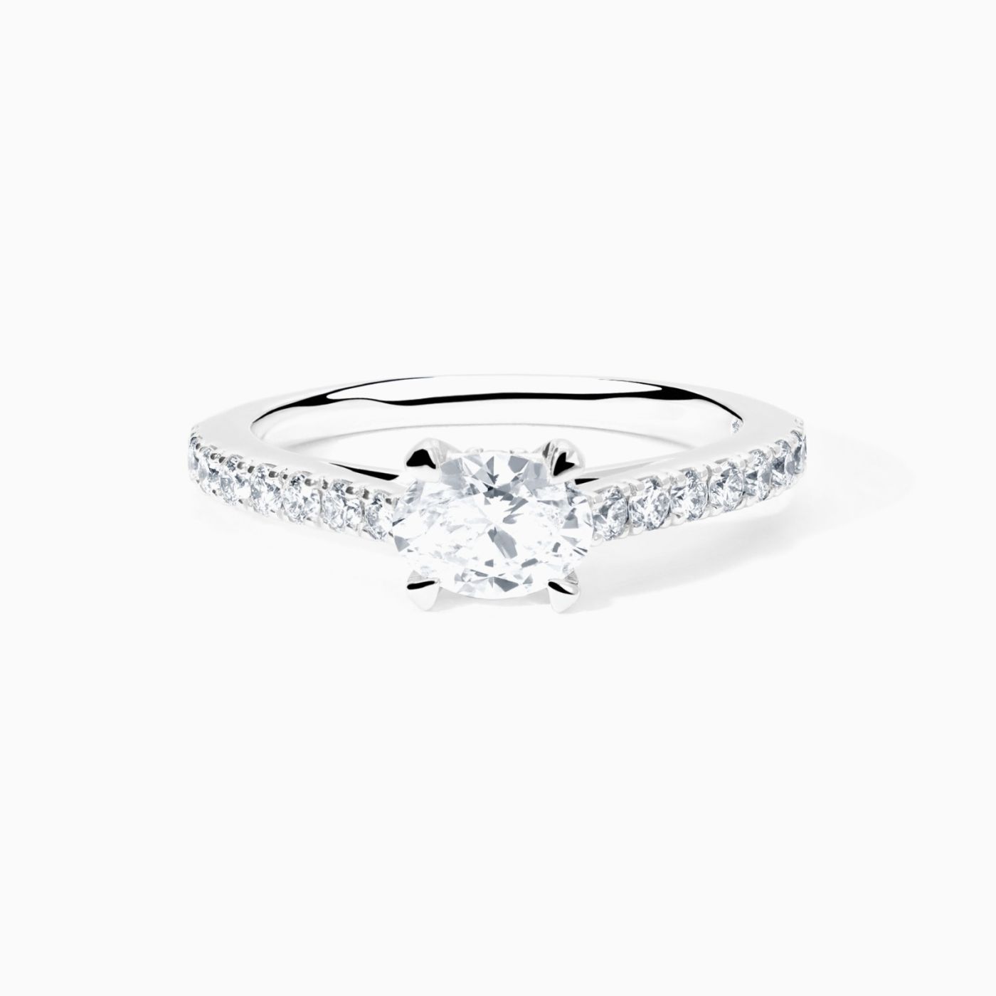 White gold solitaire engagement with an oval-cut central diamond and diamond band