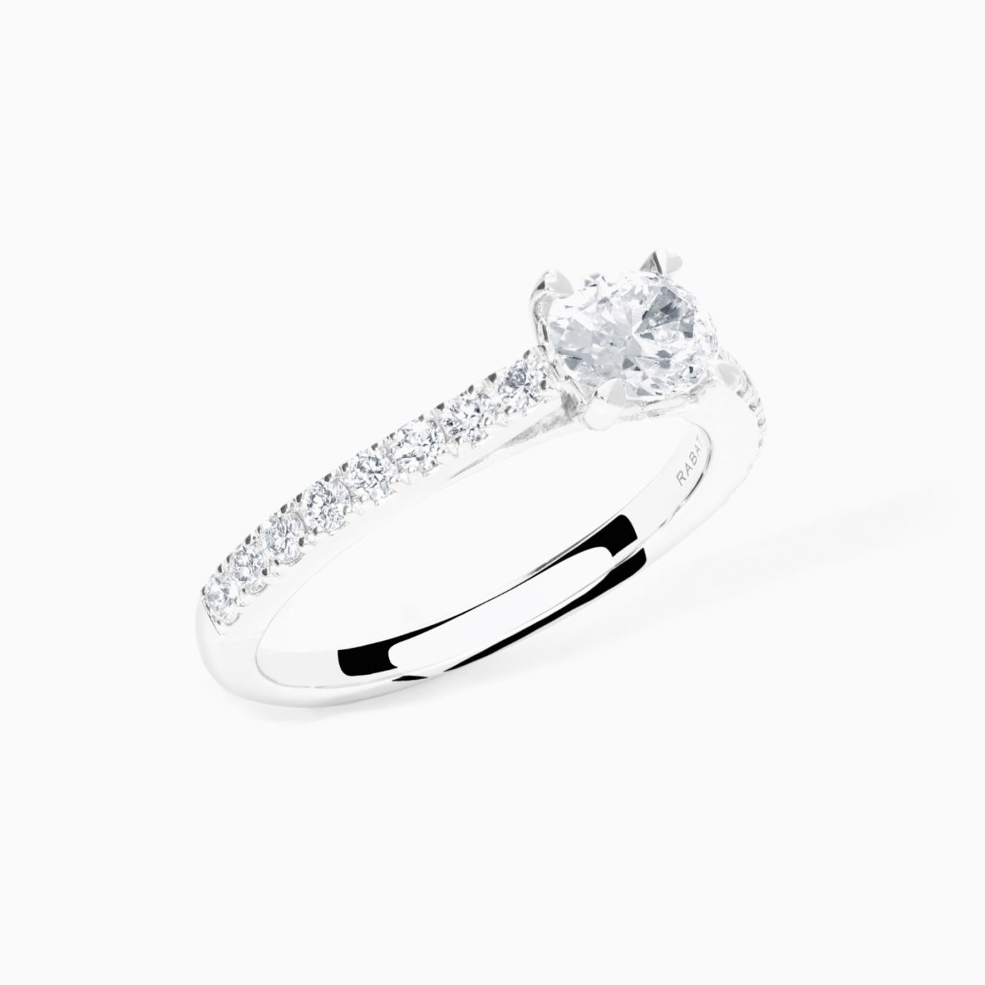White gold solitaire engagement with an oval-cut central diamond and diamond band