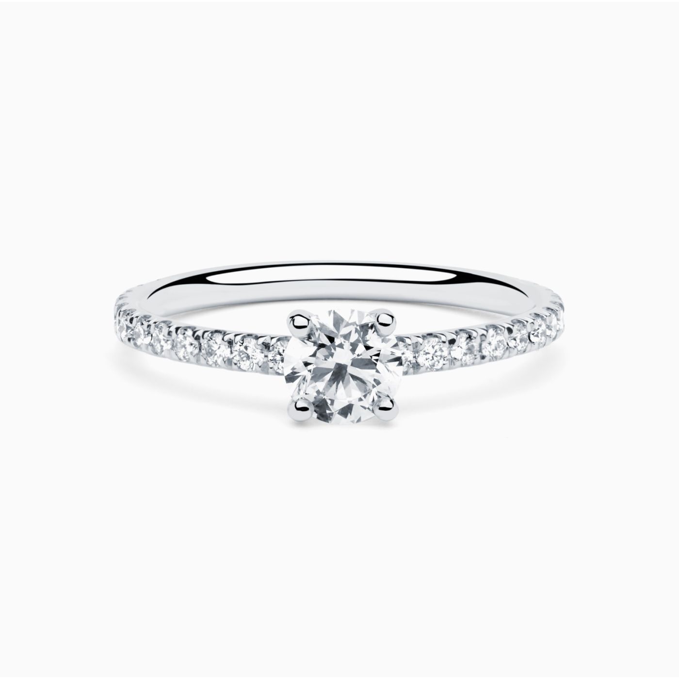 White gold solitaire engagement ring with a central diamond and diamond band