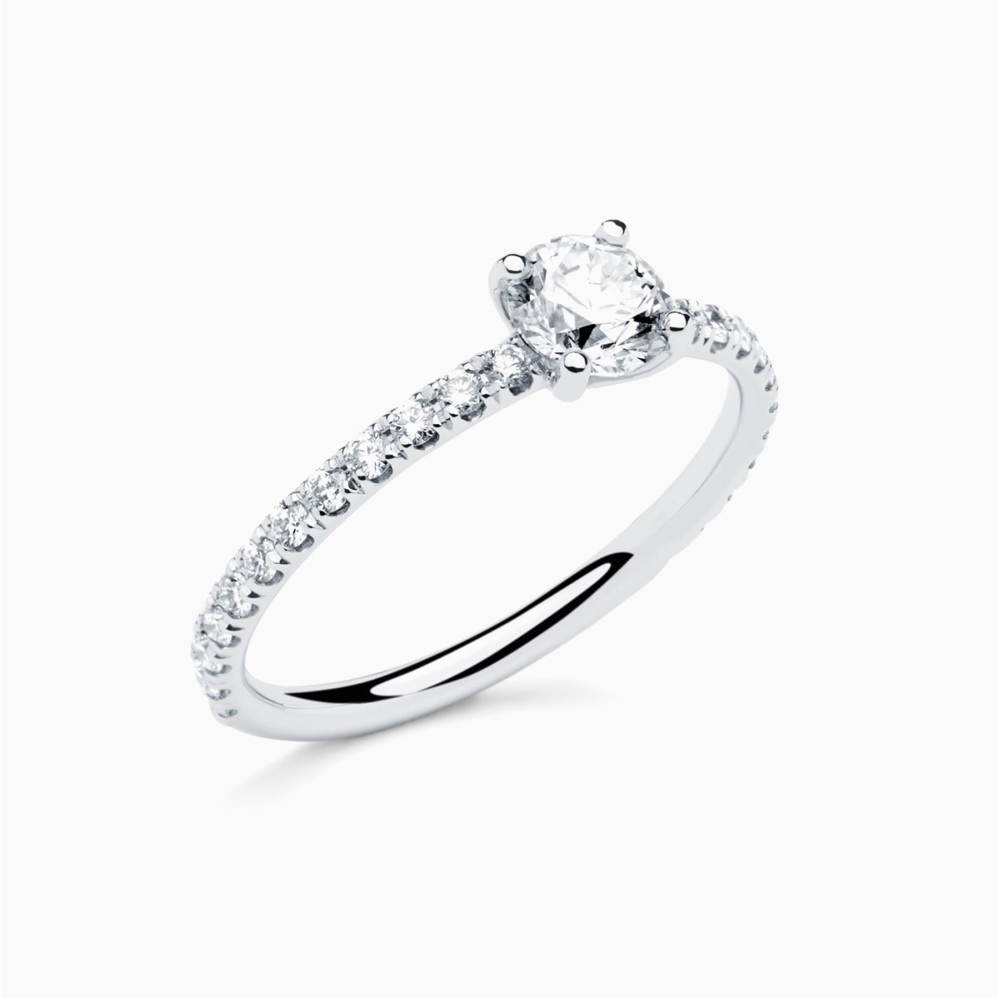 White gold solitaire engagement ring with a central diamond and diamond band