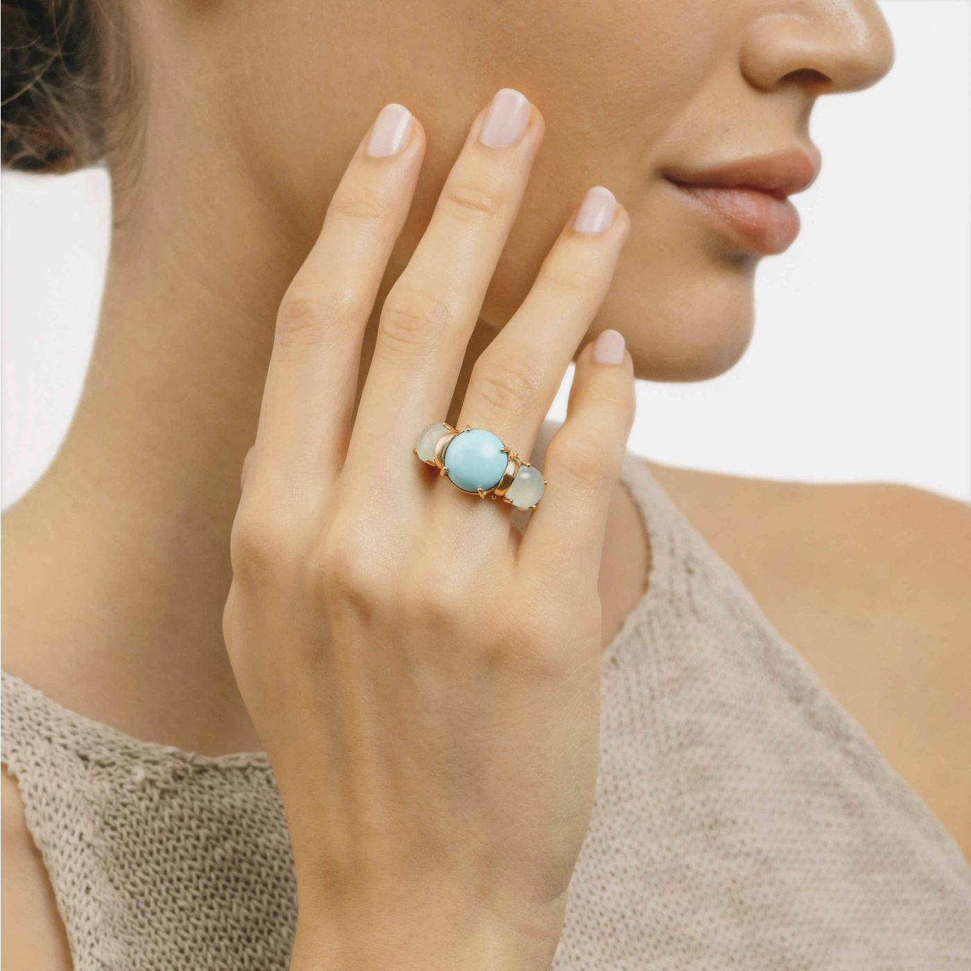 Rose gold with central turquoise gem and side chalcedony ring