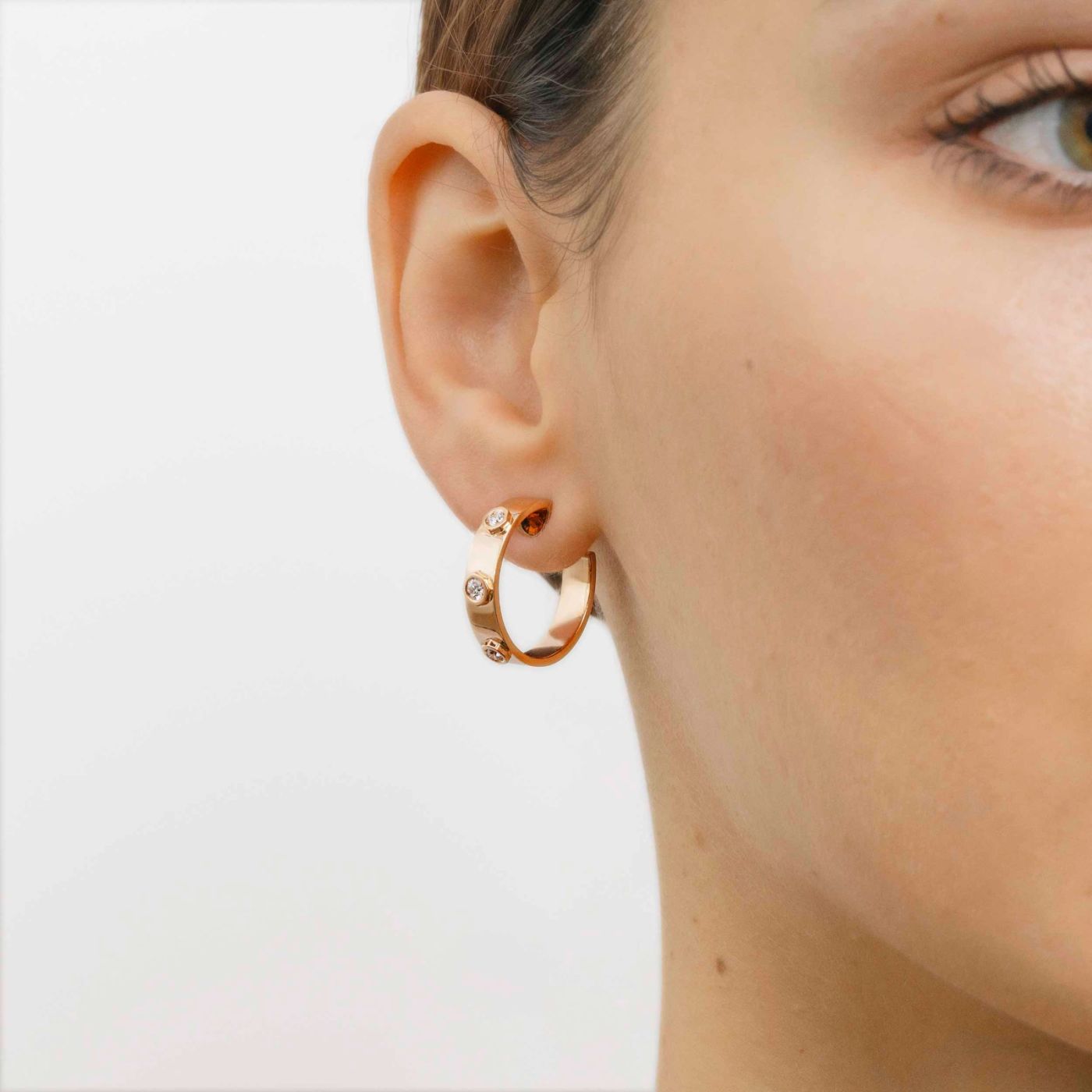 Rose gold earrings with three diamonds
