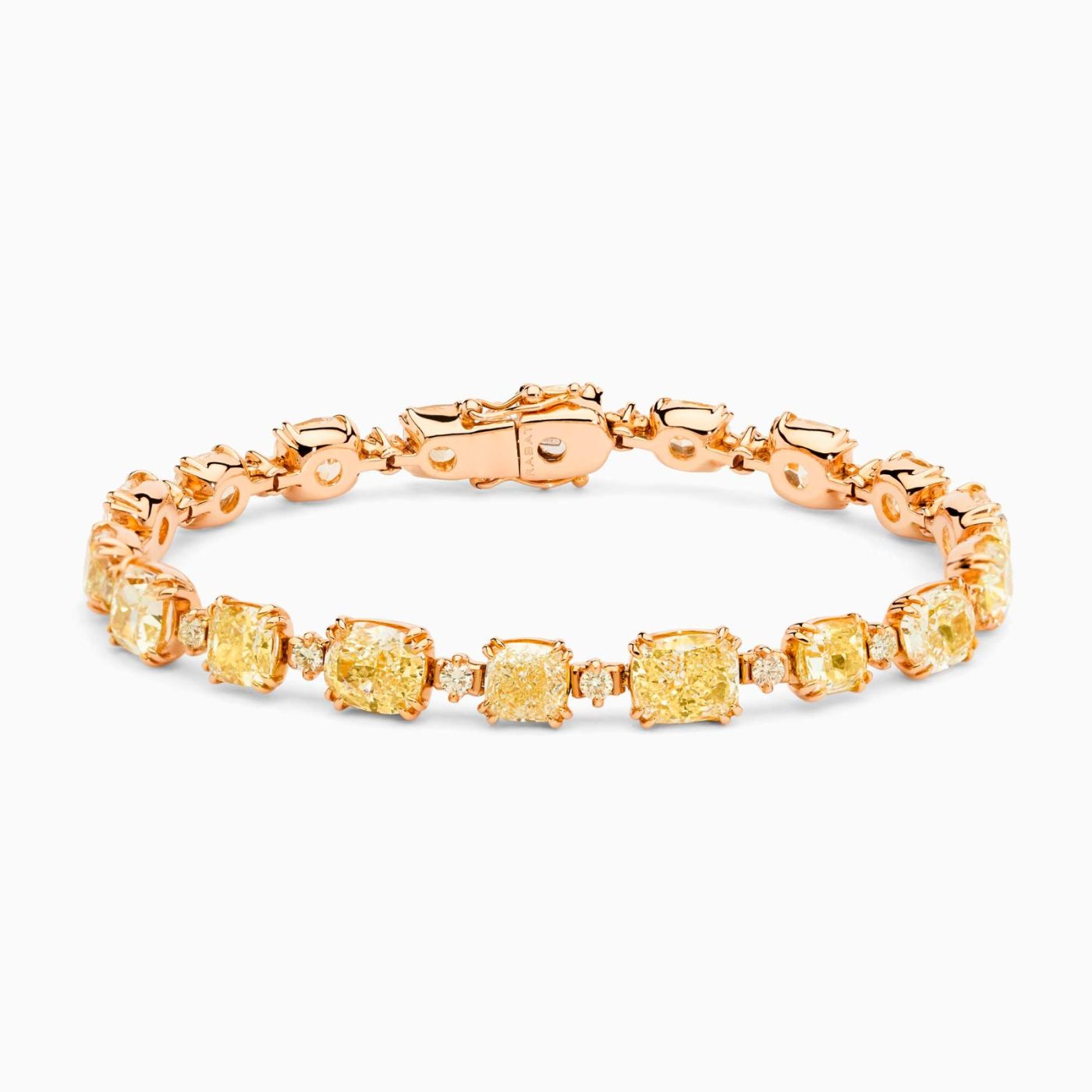 Pulsera riviere  de oro rosa con diamantes fancy