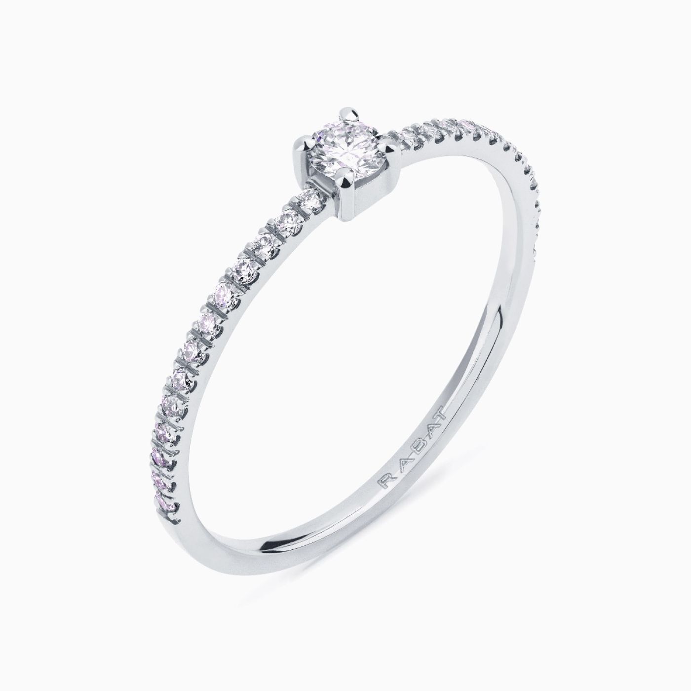 White gold solitaire engagement ring with a central diamond and diamond band