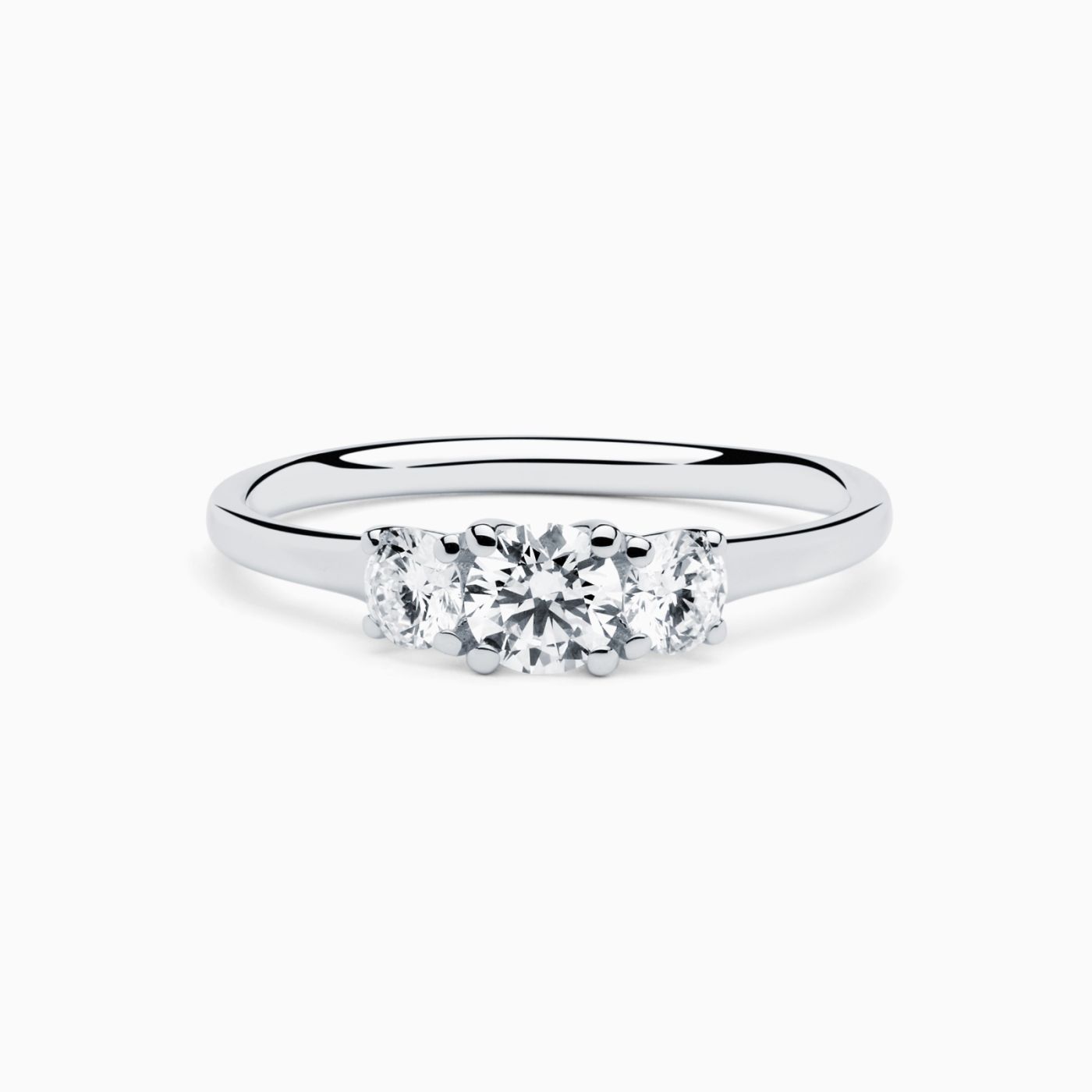 White gold engagment ring with three central diamonds