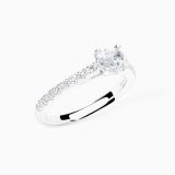 White gold solitaire engagement with an oval-cut central diamond and diamond band
