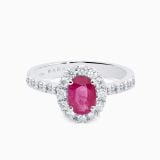 Anillo solitario de oro blanco con rubí central con orla y brazo de diamantes