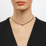 Rose gold link necklace with a central blue sapphire and diamond halo
