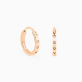 Rose gold hoop earrings with diamonds