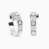 Large hoop earrings in white gold with three central diamonds and pavé diamonds