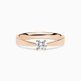 Rose gold solitaire engagement ring with central diamond