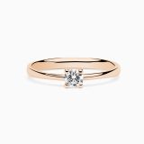 Rose gold engagement ring with central diamond