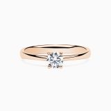 Rose gold engagement ring with central diamond