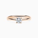 Anillo solitario de compromiso de oro rosa con diamante central