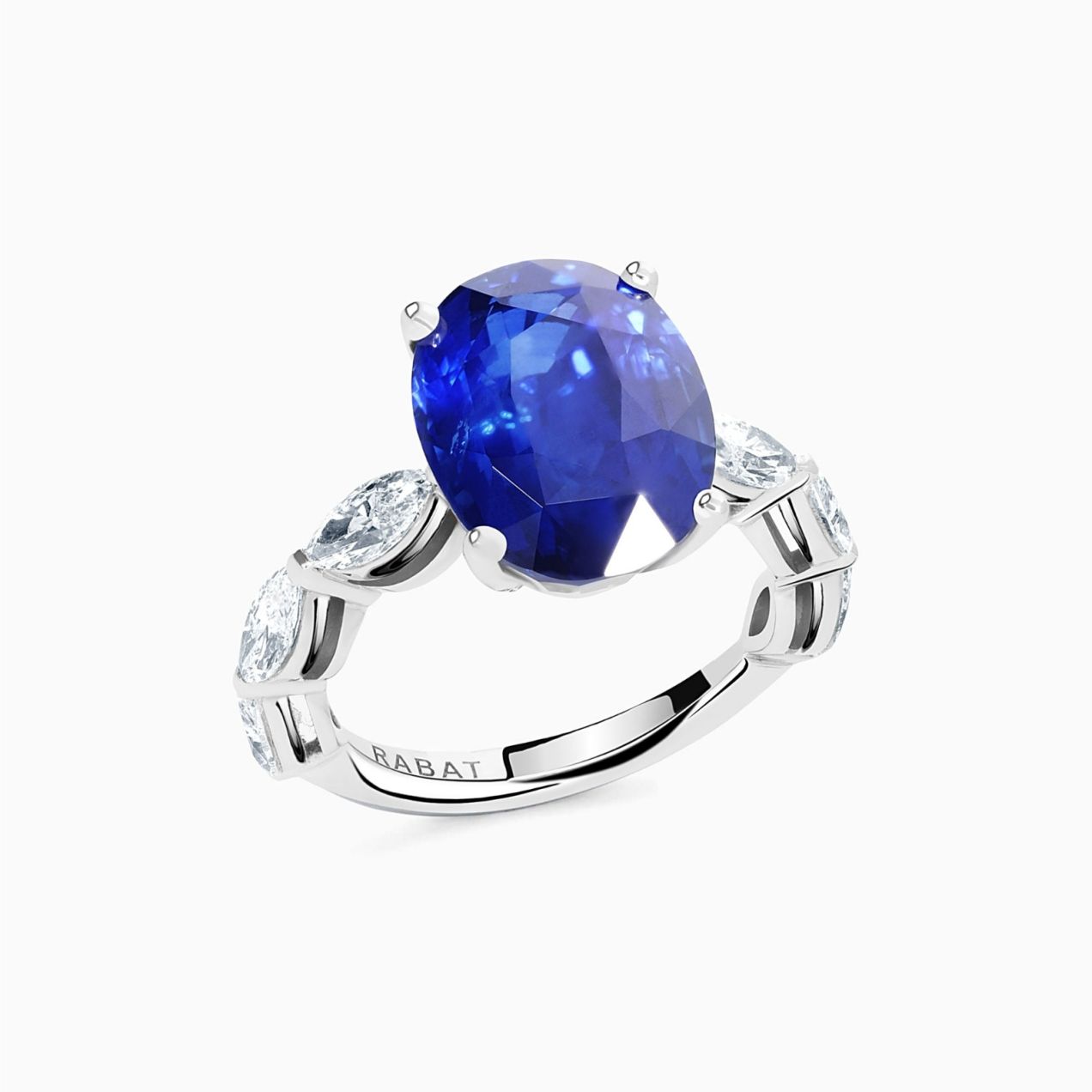 White gold with central marquise cut blue sapphire ring