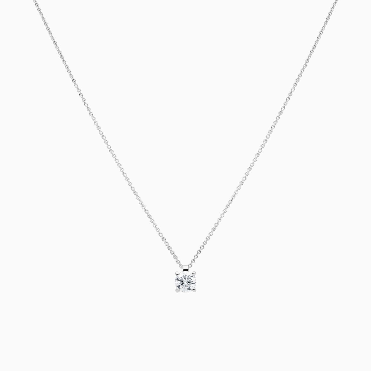 Colgante solitario de oro blanco con diamante central