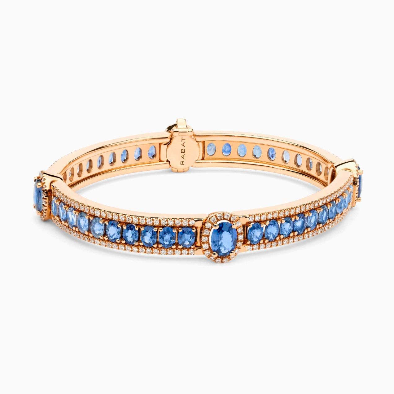 Rose gold cuff bracelet with blue sapphires