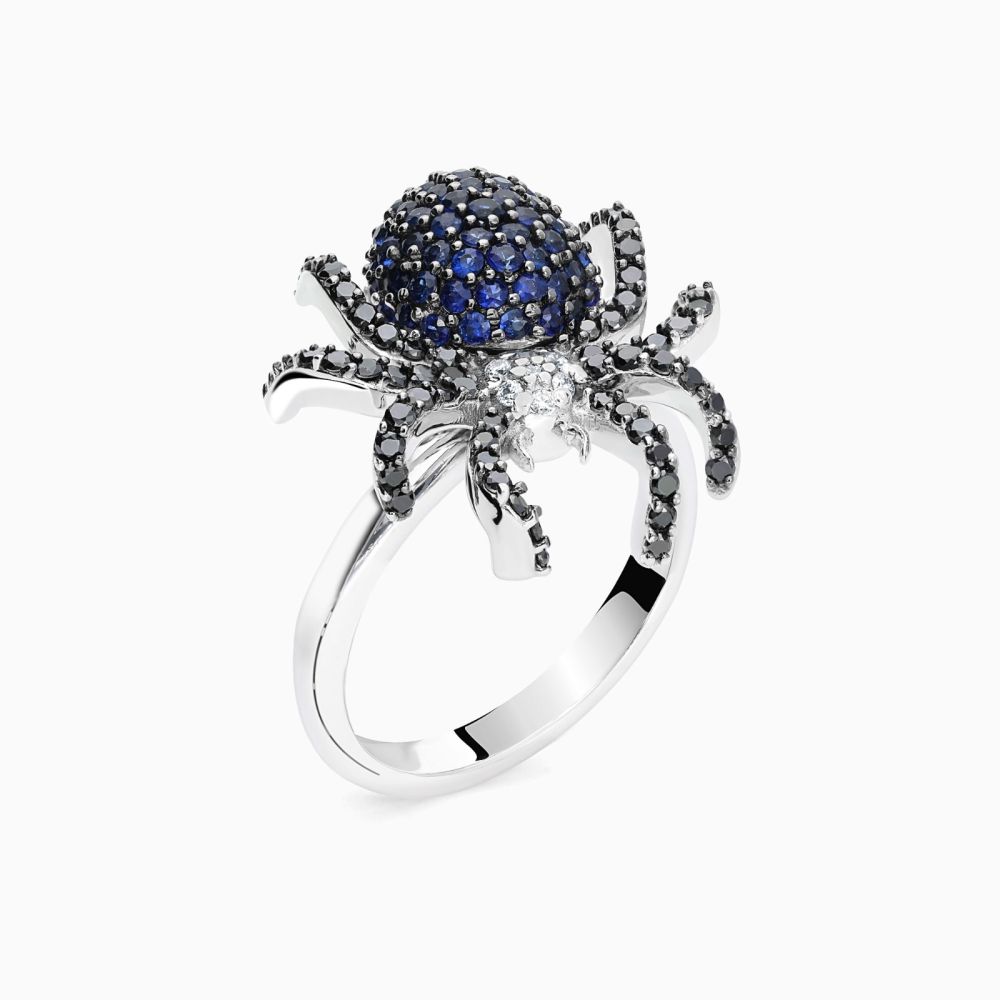 White gold spider ring with diamonds and blue sapphires