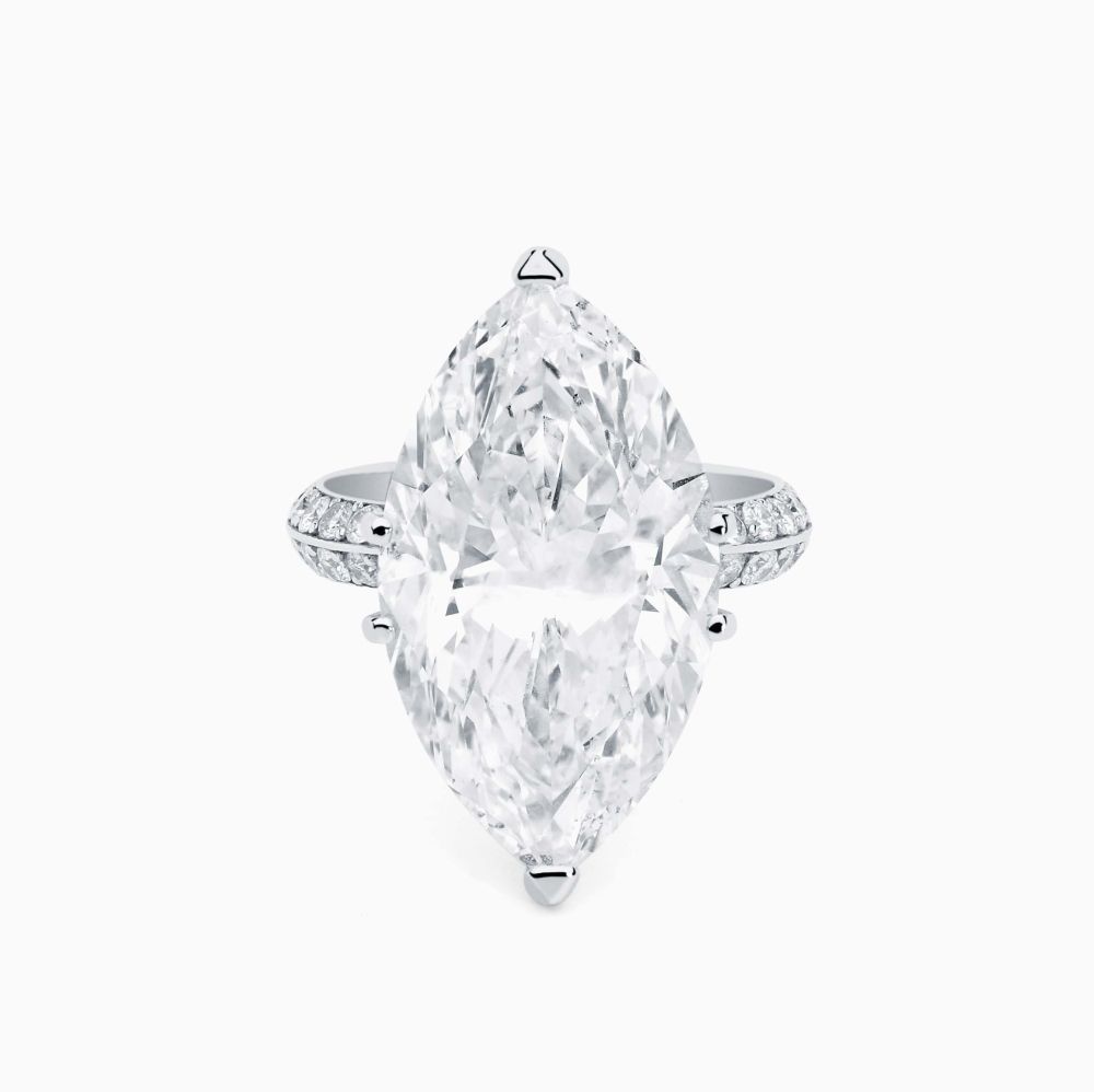 White gold solitaire ring with a marquise-cut central diamond and diamond band