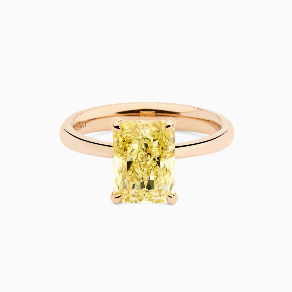 Rose gold solitaire ring with radiant-cut fancy central diamond