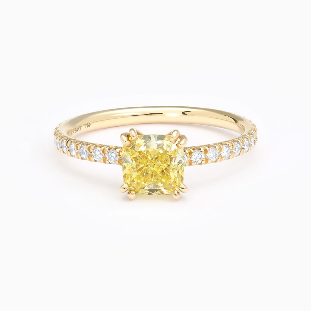 Solitaire ring in rose gold with a fancy cushion-cut central diamond and diamond band
