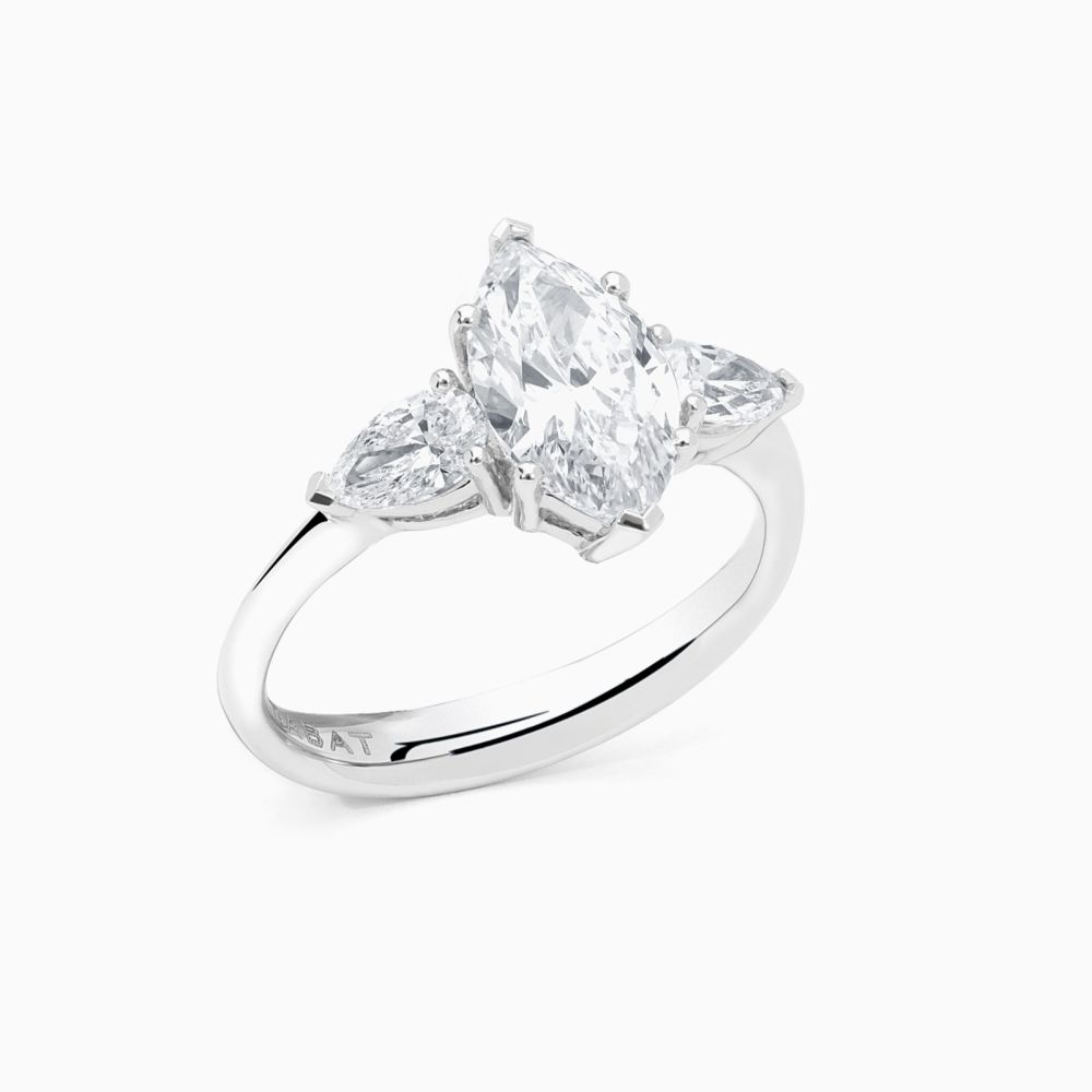 Platinum ring with a marquise-cut central diamond and pear-cut side diamonds