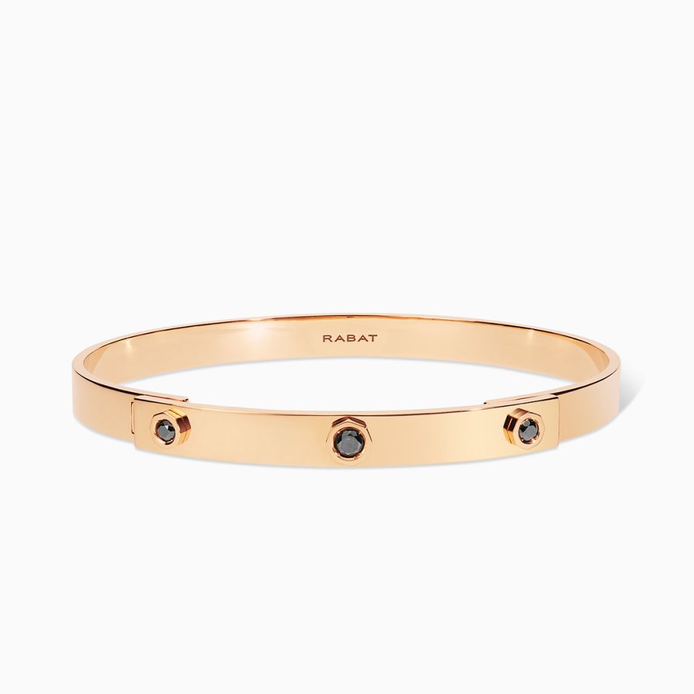 Pulsera rígida de oro rosa con tres diamantes negros