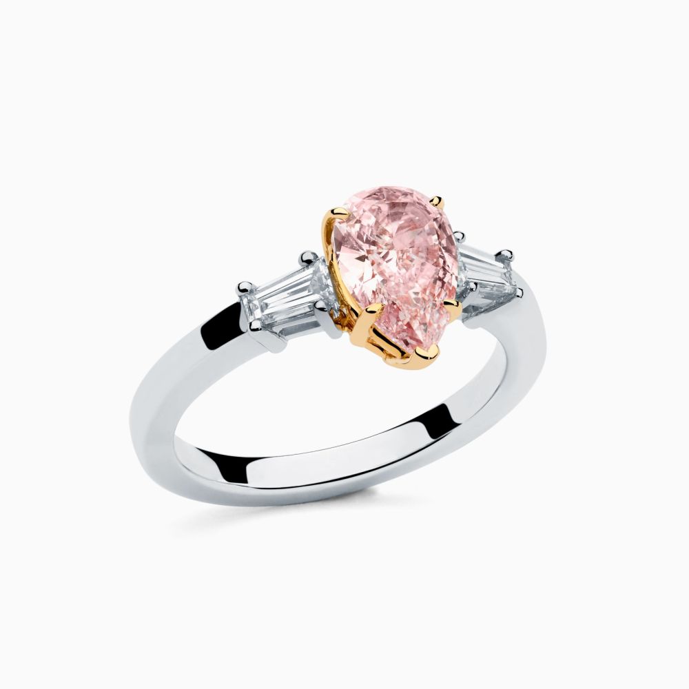 Platinum with pink fancy diamond in the center solitaire ring
