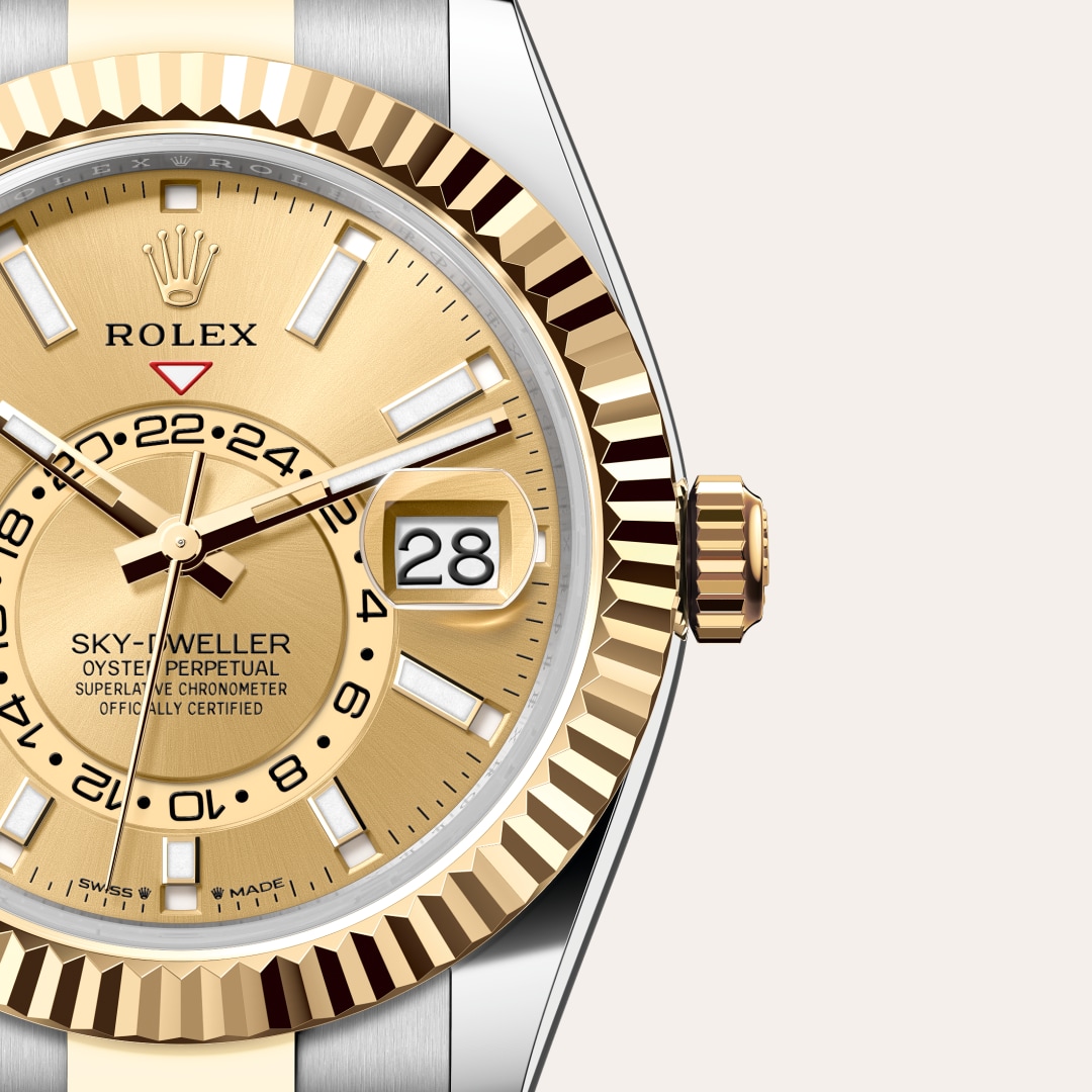 Reloj Rolex Sky-Dweller ref: M336933-0001 con esfera de color Color champagne, con cristal de Zafiro resistente a las rayaduras, lente Cyclops sobre la fecha. Presenta bisel Estriado, giratorio bidireccional Rolex Ring Command, corona Enroscada con sistem 